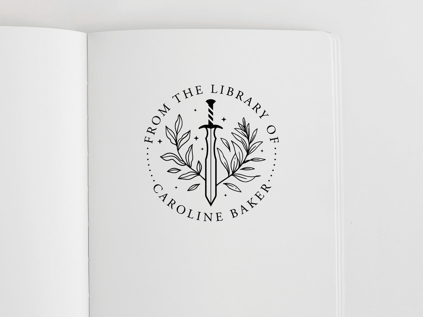 book stamp with a sword and a custom name